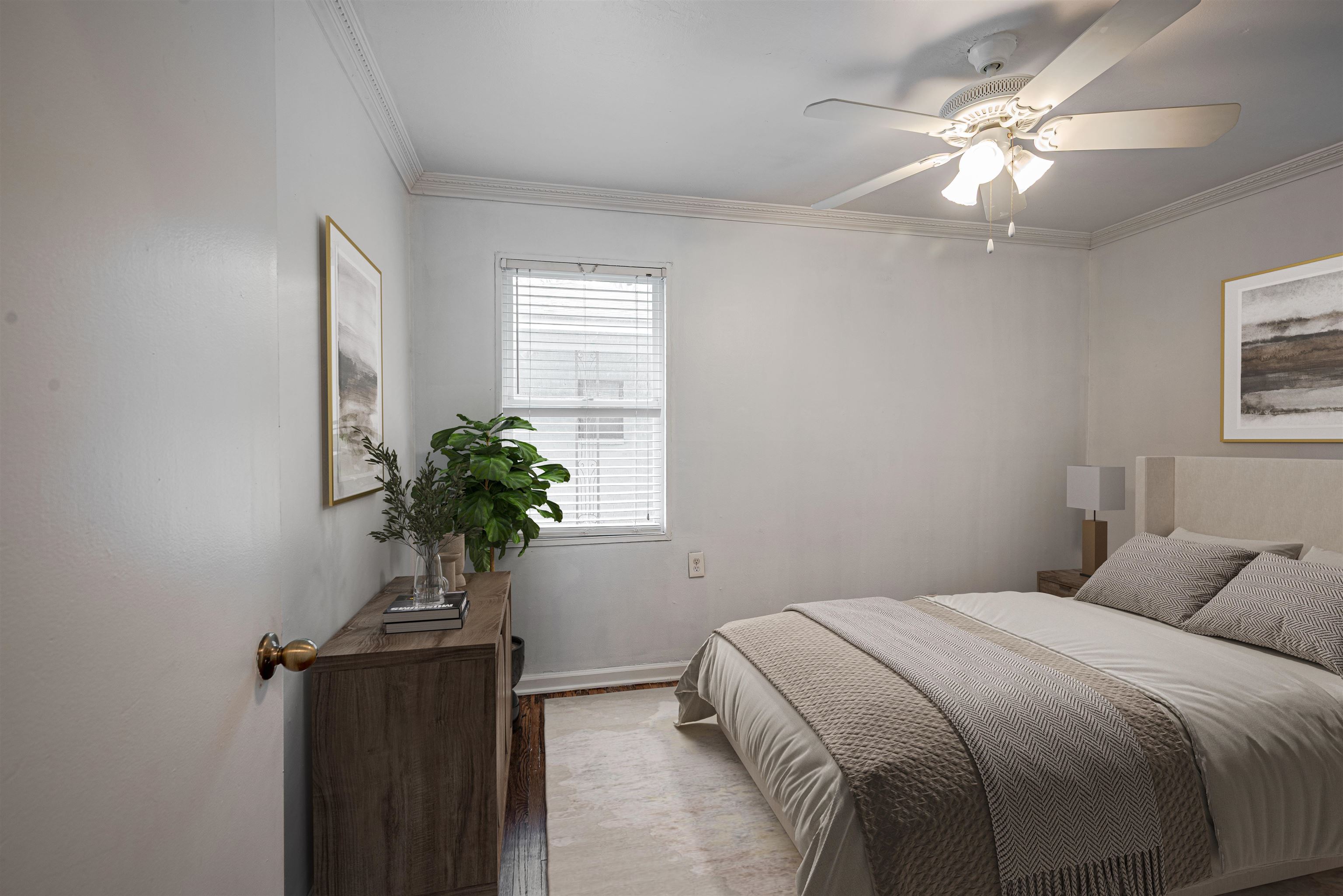 4861 Verne Road Memphis, TN 38117 - Photo 7 of 17 a bedroom with a bed and a potted plant