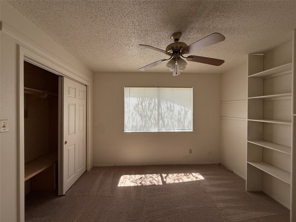 8906 Pineridge Drive Austin, TX 78729 - Photo 17 of 35 a view of an empty room with a window