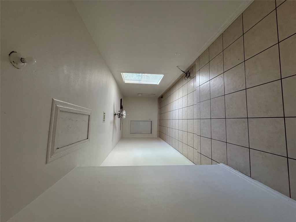 8906 Pineridge Drive Austin, TX 78729 - Photo 26 of 35 a view of an empty room with a window