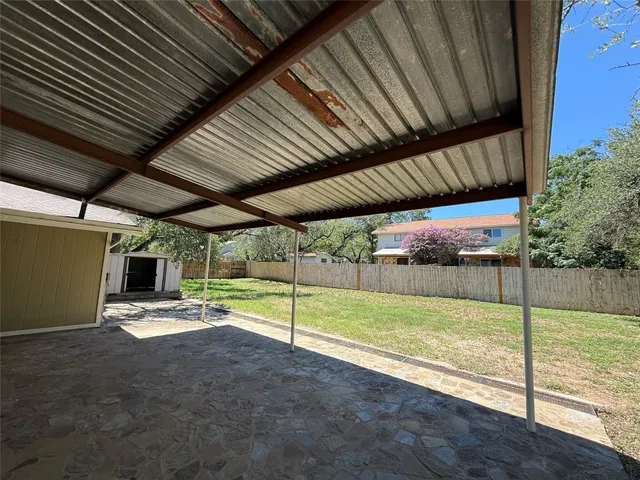 a view of a backyard of the house