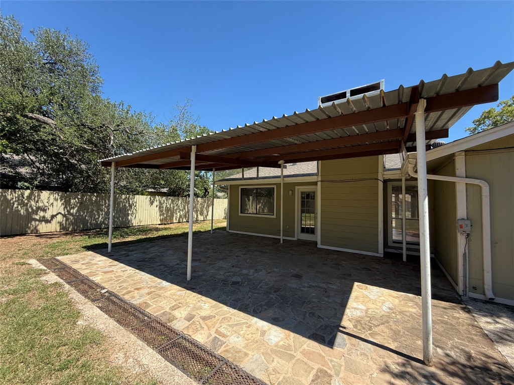8906 Pineridge Drive Austin, TX 78729 - Photo 33 of 35 a backyard of a house with table and chairs
