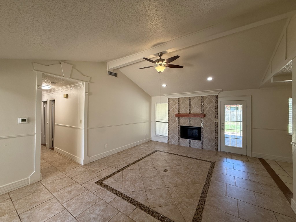 8906 Pineridge Drive Austin, TX 78729 - Photo 6 of 35 an empty room with windows and fireplace