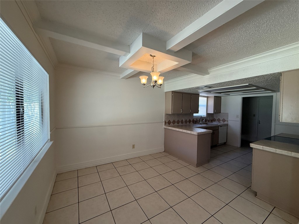 8906 Pineridge Drive Austin, TX 78729 - Photo 7 of 35 a kitchen with a sink and cabinets