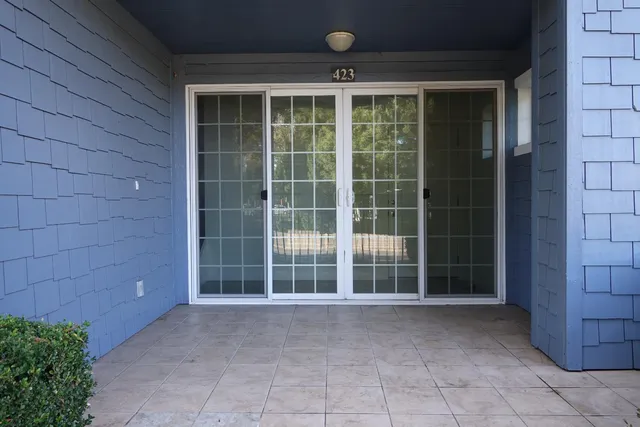 a kitchen with a sink and a refrigerator