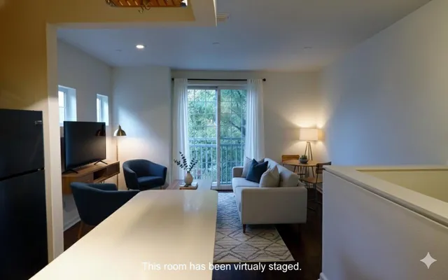 a bedroom with a bed chair and a window