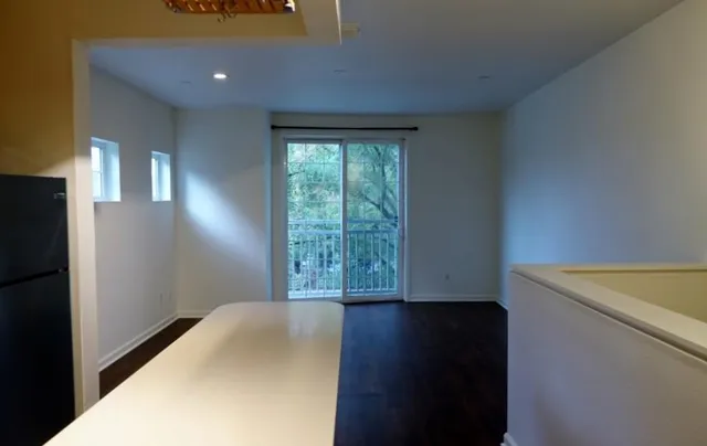 a view of a bathroom with wooden floor