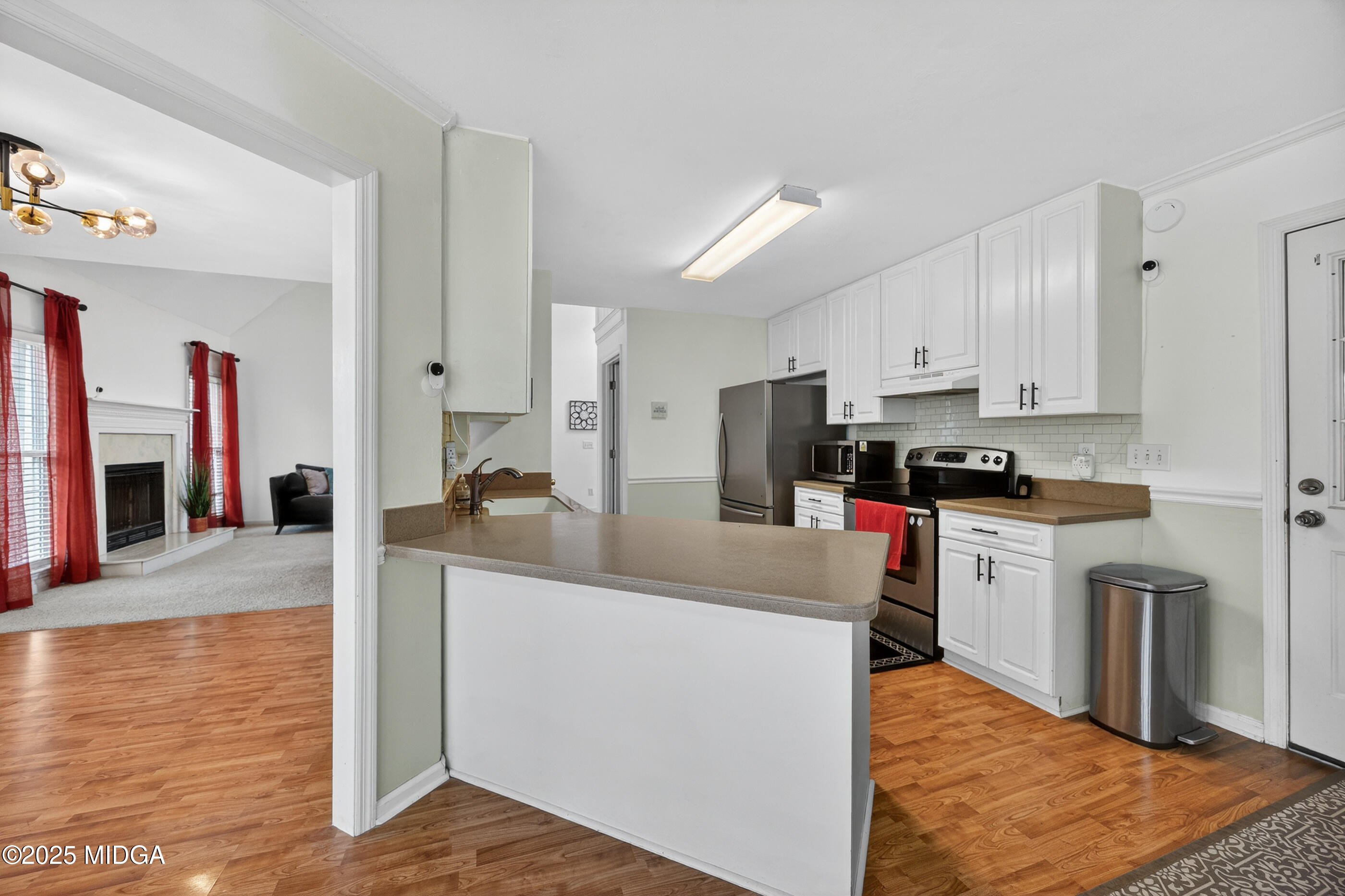 199 Springfield Boulevard Macon, GA 31210 - Photo 18 of 44 a kitchen with stainless steel appliances granite countertop a sink stove and refrigerator