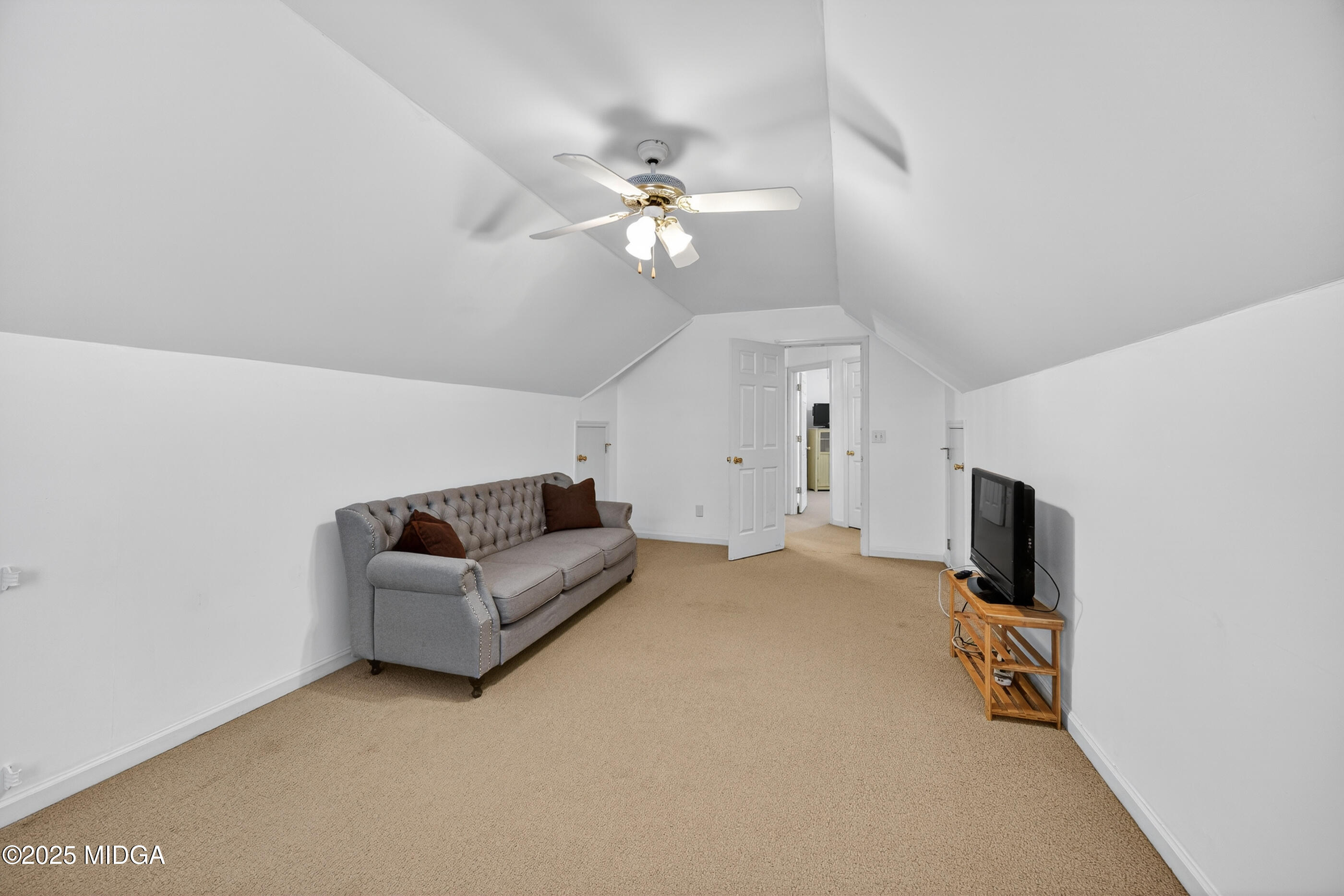199 Springfield Boulevard Macon, GA 31210 - Photo 32 of 44 a living room with furniture and a flat screen tv