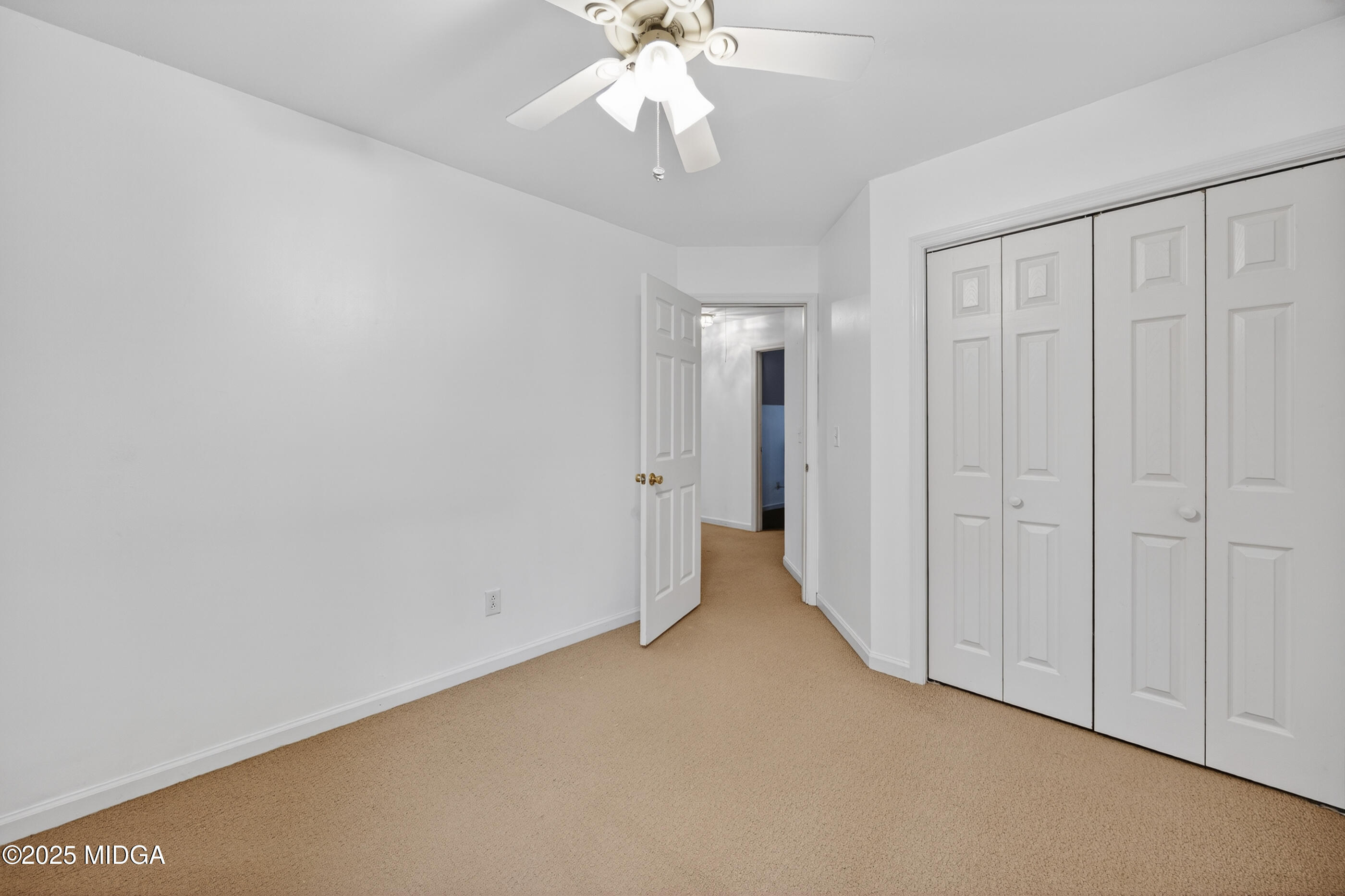 199 Springfield Boulevard Macon, GA 31210 - Photo 37 of 44 a view of a hallway with a chandelier fan and closet area