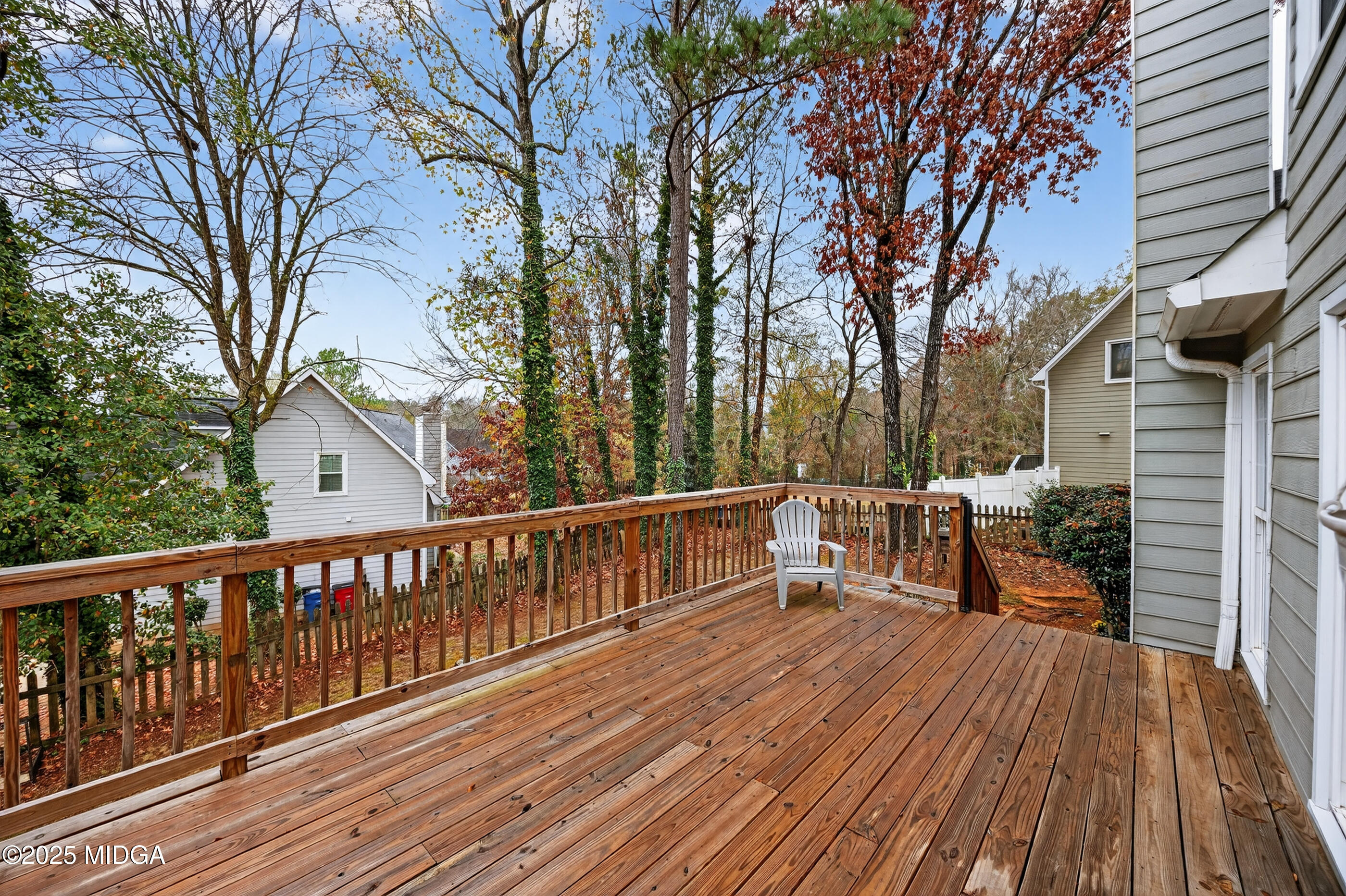 199 Springfield Boulevard Macon, GA 31210 - Photo 38 of 44 a view of a deck with chairs and large trees