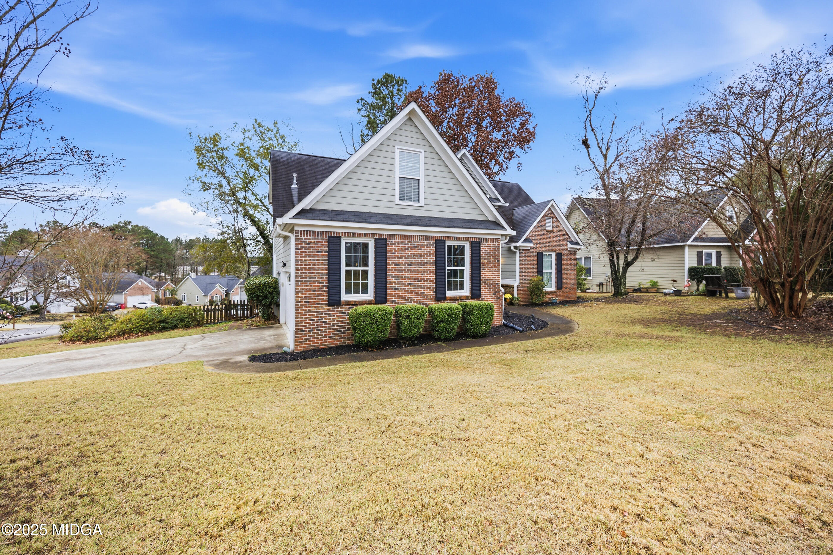 199 Springfield Boulevard Macon, GA 31210 - Photo 4 of 44 a view of a house with a yard and garage
