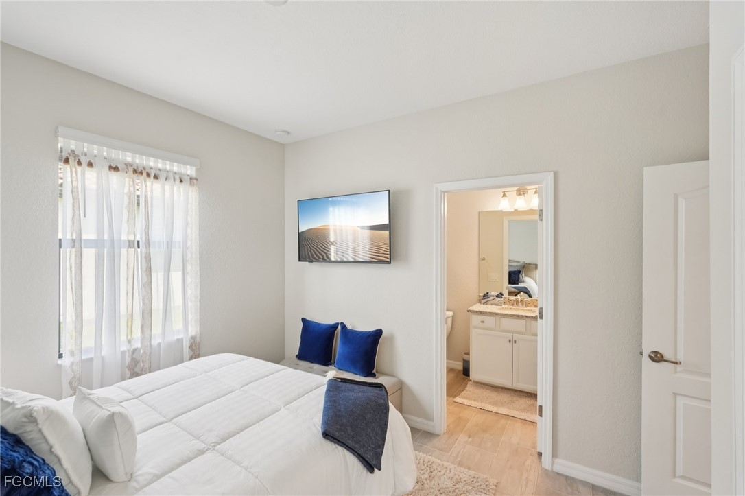11872 Arbor Trace Drive Fort Myers, FL 33913 - Photo 17 of 50 a bedroom with a bed and a chair