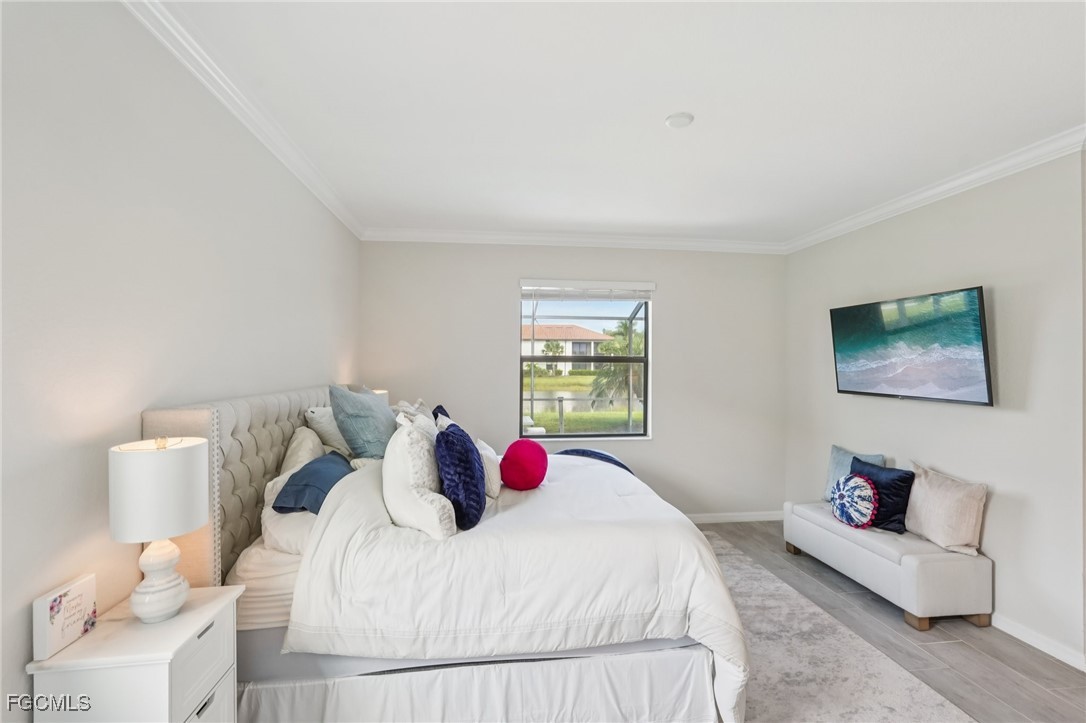 11872 Arbor Trace Drive Fort Myers, FL 33913 - Photo 20 of 50 a bedroom with a bed and a couch