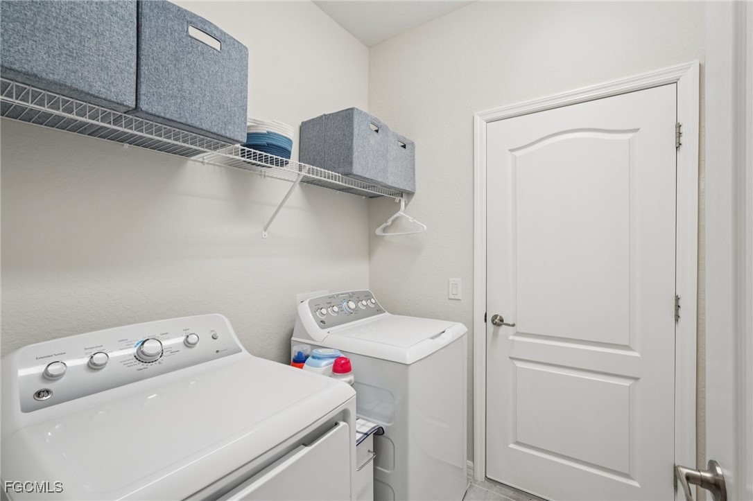 11872 Arbor Trace Drive Fort Myers, FL 33913 - Photo 22 of 50 a utility room with dryer and washer