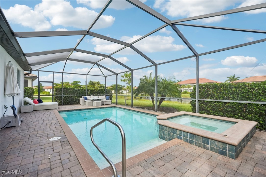 11872 Arbor Trace Drive Fort Myers, FL 33913 - Photo 23 of 50 a view of swimming pool with a patio and a garden