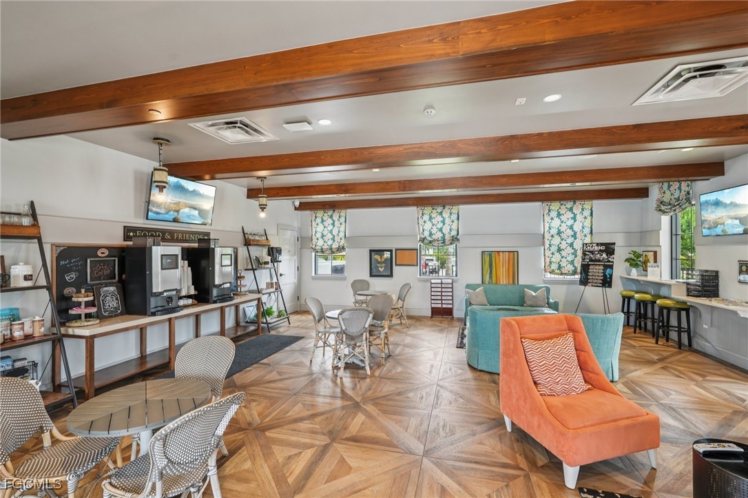 11872 Arbor Trace Drive Fort Myers, FL 33913 - Photo 34 of 50 a living room with furniture a wooden floor and next to a window