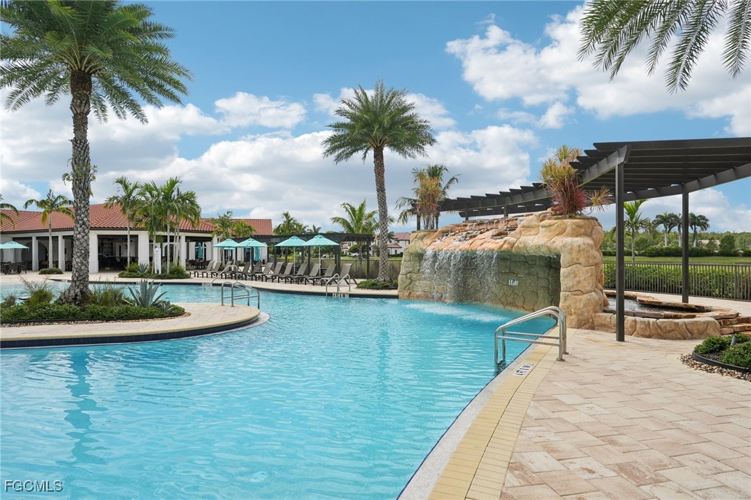 11872 Arbor Trace Drive Fort Myers, FL 33913 - Photo 41 of 50 a view of a swimming pool with a garden
