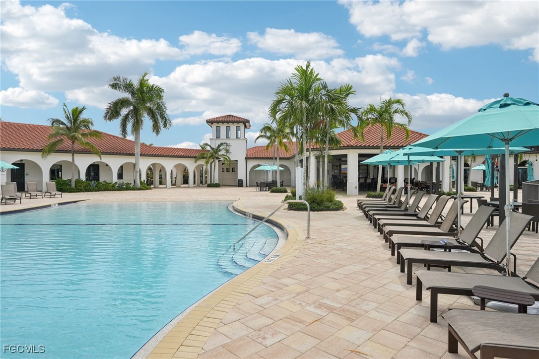 11872 Arbor Trace Drive Fort Myers, FL 33913 - Photo 42 of 50 a view of a patio with swimming pool table and chairs