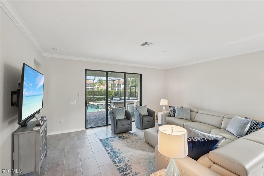11872 Arbor Trace Drive Fort Myers, FL 33913 - Photo 6 of 50 a living room with furniture and a flat screen tv