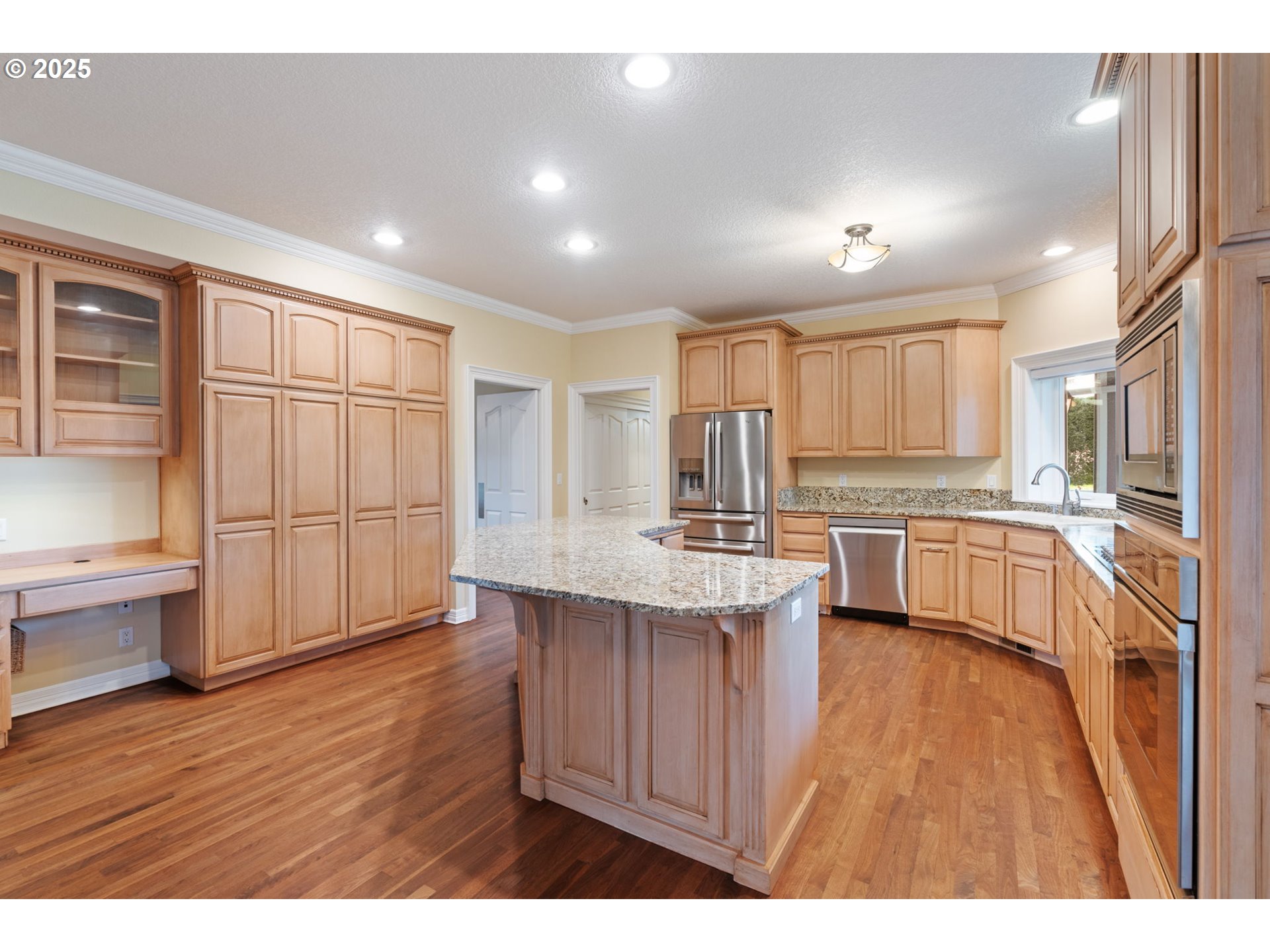 3110 Northwest Lacamas Drive Camas, WA 98607 - Photo 19 of 48 a kitchen with refrigerator cabinets and wooden floor