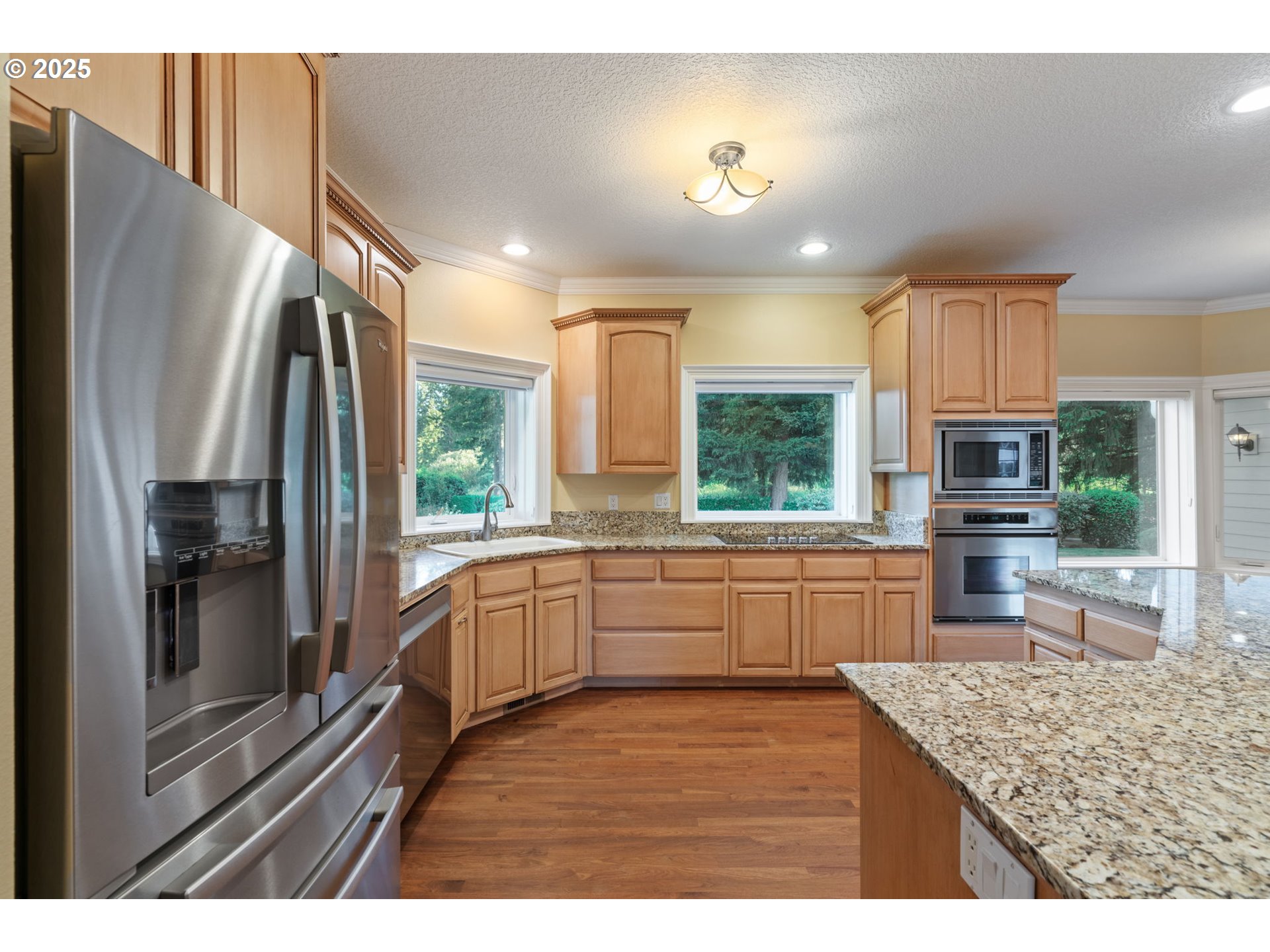3110 Northwest Lacamas Drive Camas, WA 98607 - Photo 20 of 48 a kitchen with stainless steel appliances granite countertop a refrigerator and a sink