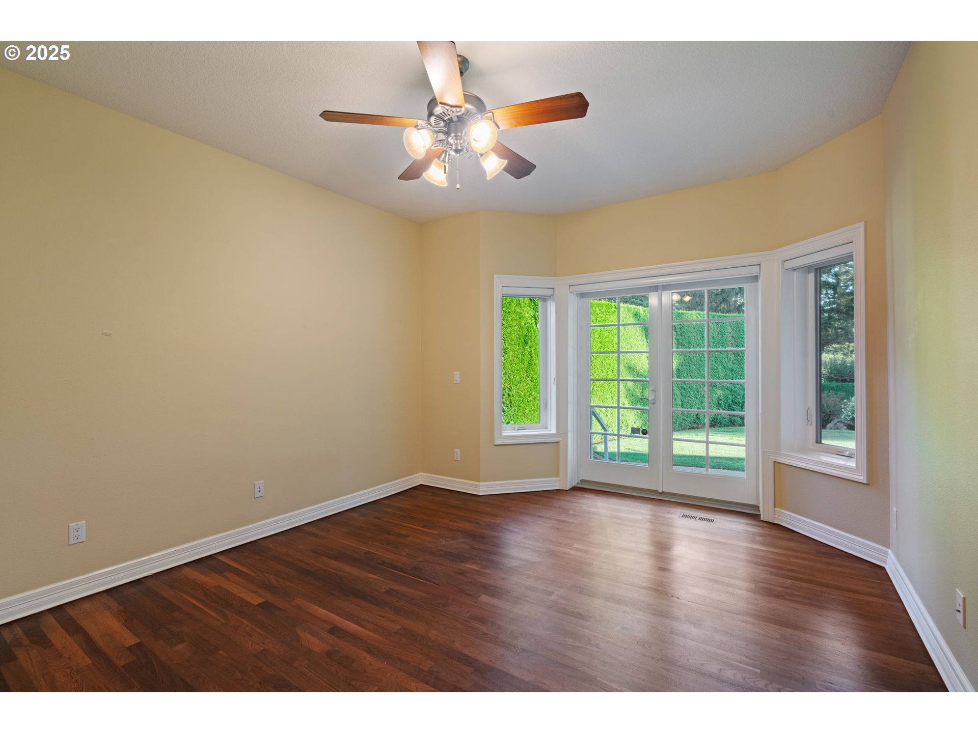 3110 Northwest Lacamas Drive Camas, WA 98607 - Photo 27 of 48 a view of an empty room with wooden floor and a window