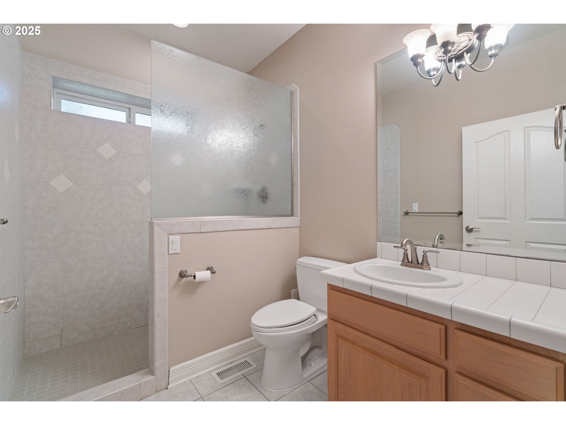 3110 Northwest Lacamas Drive Camas, WA 98607 - Photo 30 of 48 a bathroom with a sink a toilet and a mirror