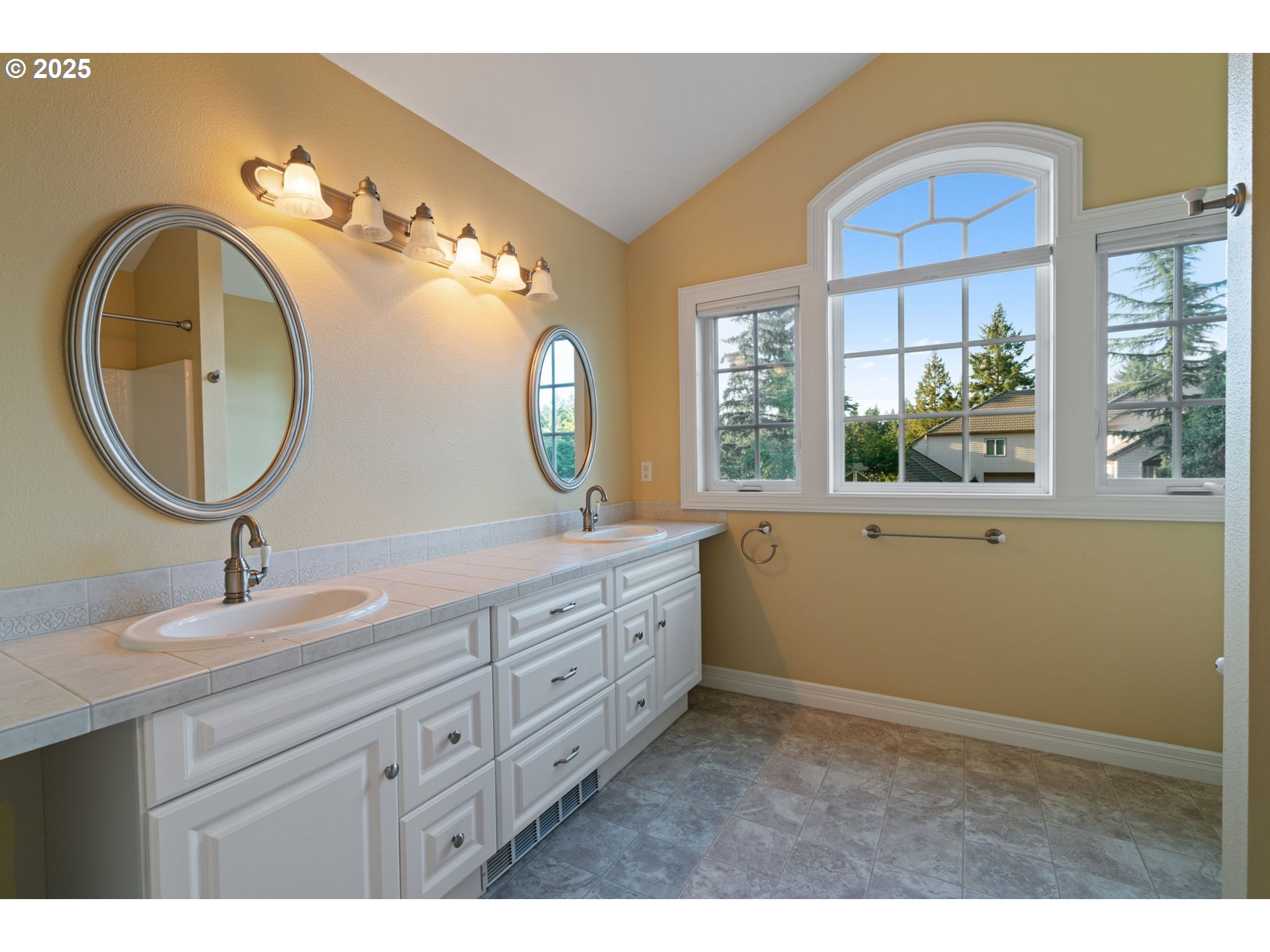 3110 Northwest Lacamas Drive Camas, WA 98607 - Photo 31 of 48 a bathroom with a double vanity sink and a mirror