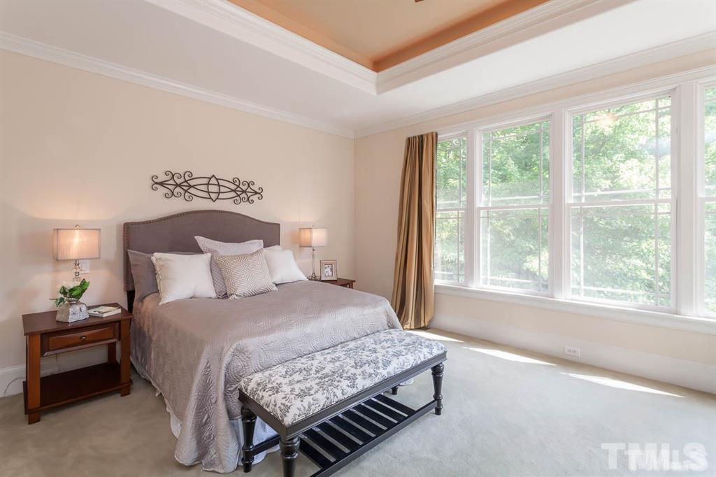10500 Charmford Way Raleigh, NC 27615 - Photo 16 of 22 a bedroom with a bed and a window