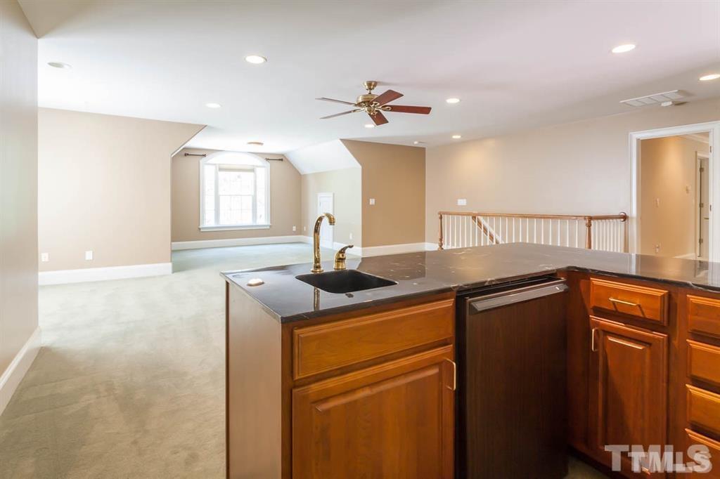 10500 Charmford Way Raleigh, NC 27615 - Photo 19 of 22 a kitchen with a sink and a refrigerator