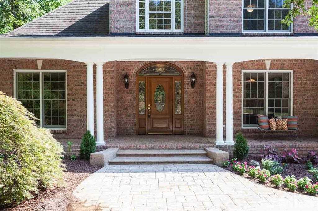 10500 Charmford Way Raleigh, NC 27615 - Photo 3 of 22 a front view of a house with a garden