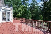 10500 Charmford Way Raleigh, NC 27615 - Photo 21 of 22 a balcony with wooden floor and fence