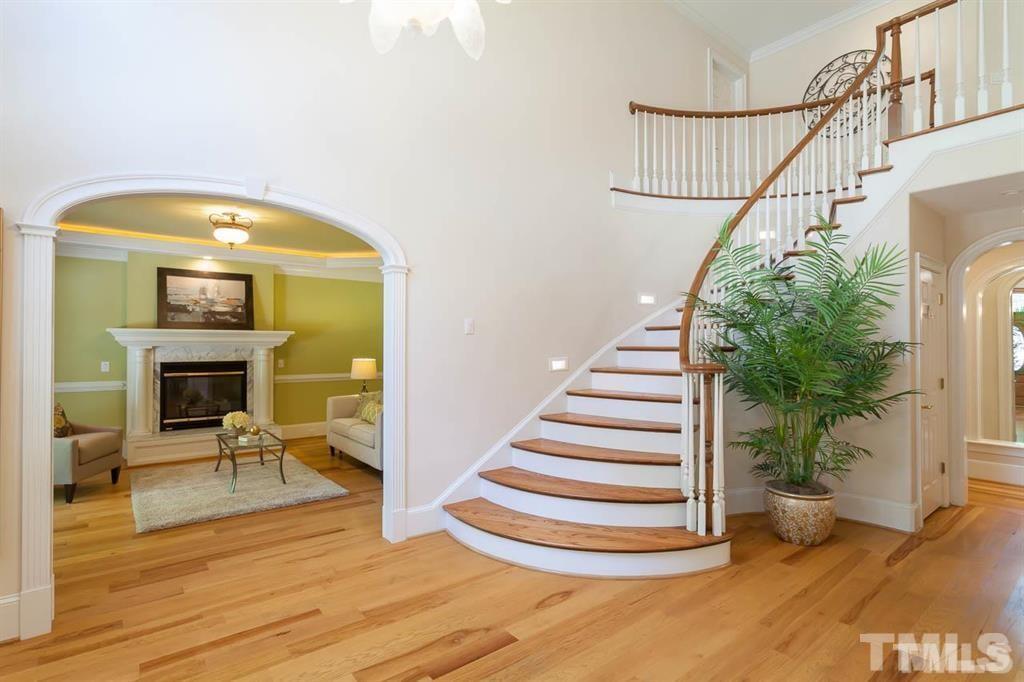 10500 Charmford Way Raleigh, NC 27615 - Photo 5 of 22 a view of entryway and hall with wooden floor