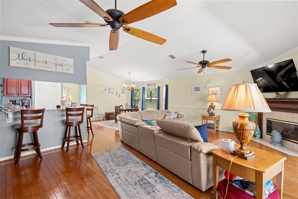 6170 Seaside Drive New Port Richey, FL 34652 - Photo 14 of 89 a living room with furniture and a flat screen tv