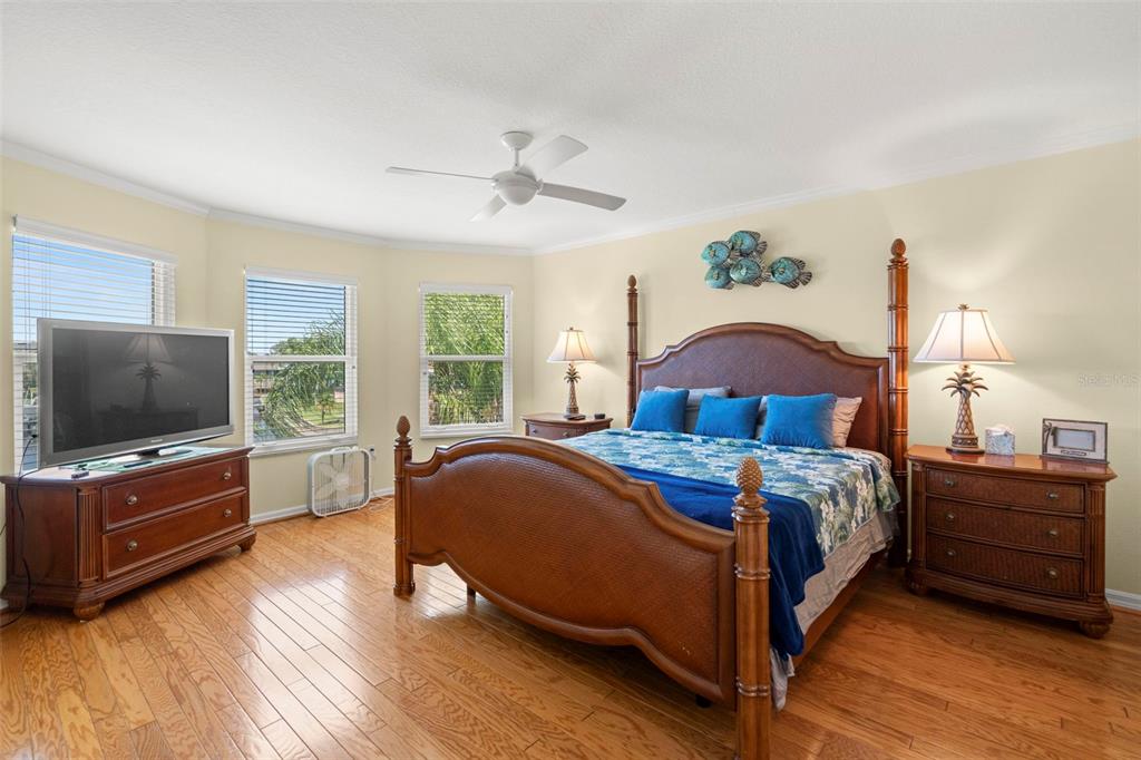 6170 Seaside Drive New Port Richey, FL 34652 - Photo 21 of 89 a bedroom with a bed and a flat screen tv