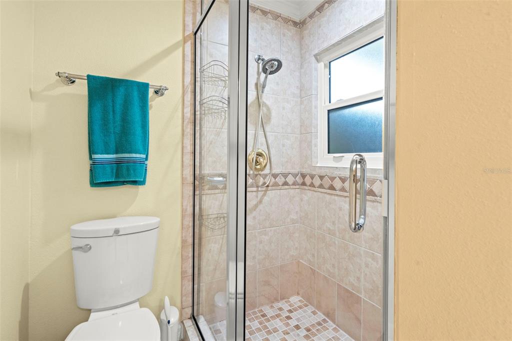 6170 Seaside Drive New Port Richey, FL 34652 - Photo 27 of 89 a bathroom with a toilet and a shower