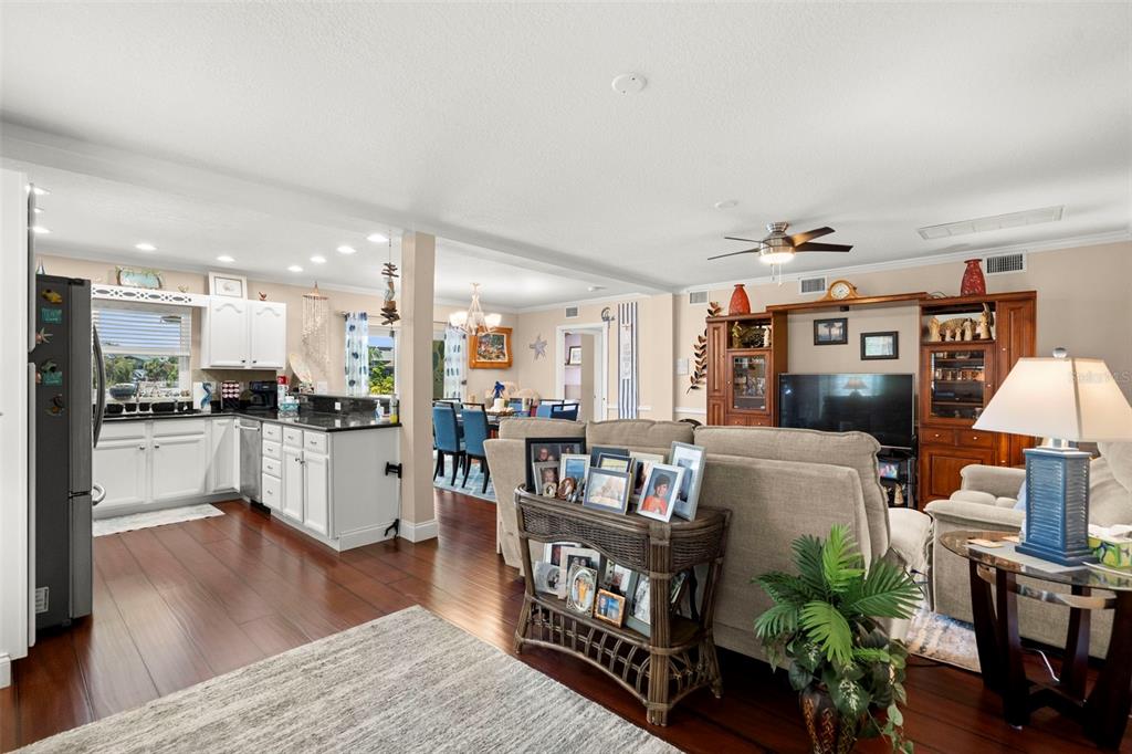 6170 Seaside Drive New Port Richey, FL 34652 - Photo 37 of 89 a living room with furniture and a kitchen view