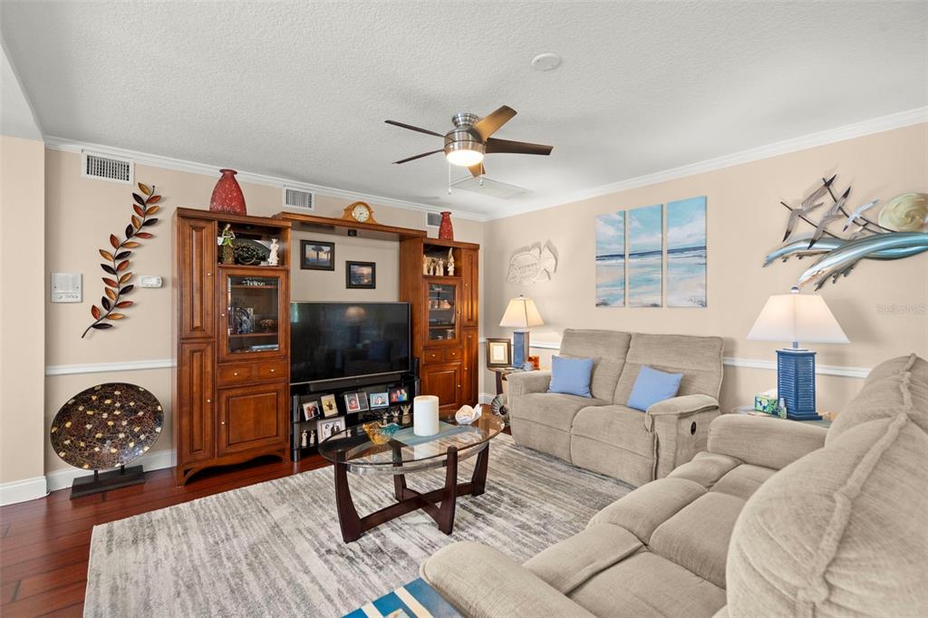 6170 Seaside Drive New Port Richey, FL 34652 - Photo 38 of 89 a living room with furniture and wooden floor