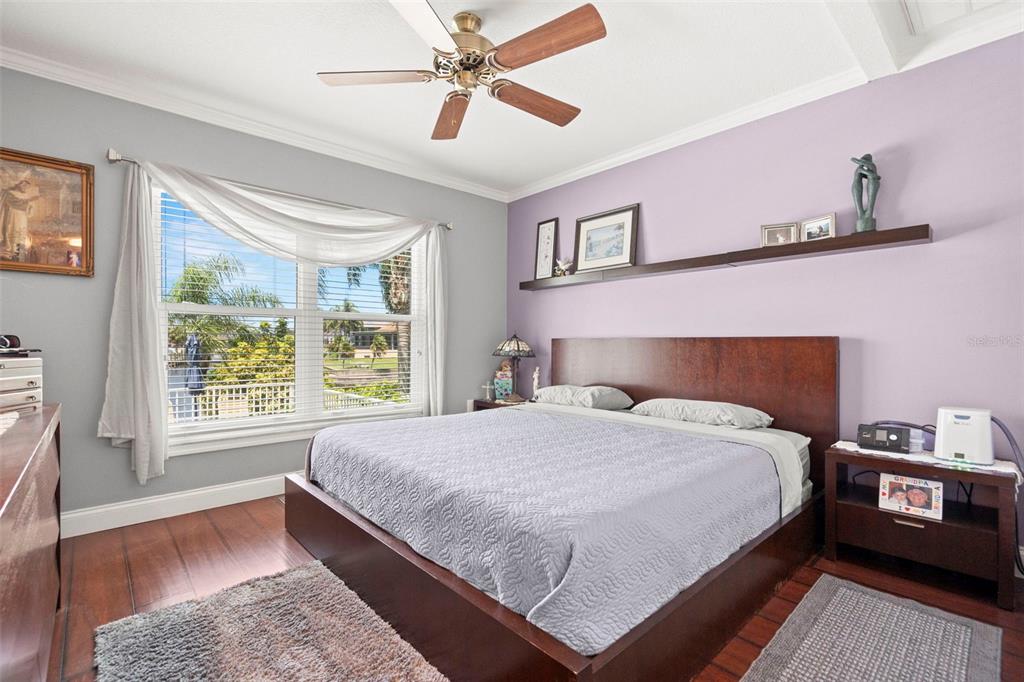 6170 Seaside Drive New Port Richey, FL 34652 - Photo 45 of 89 a bedroom with a bed a dresser next to a window
