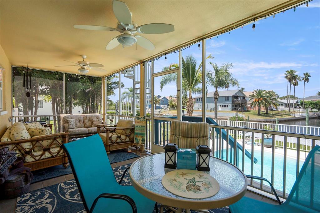 6170 Seaside Drive New Port Richey, FL 34652 - Photo 49 of 89 a dining room with furniture a rug and a large window