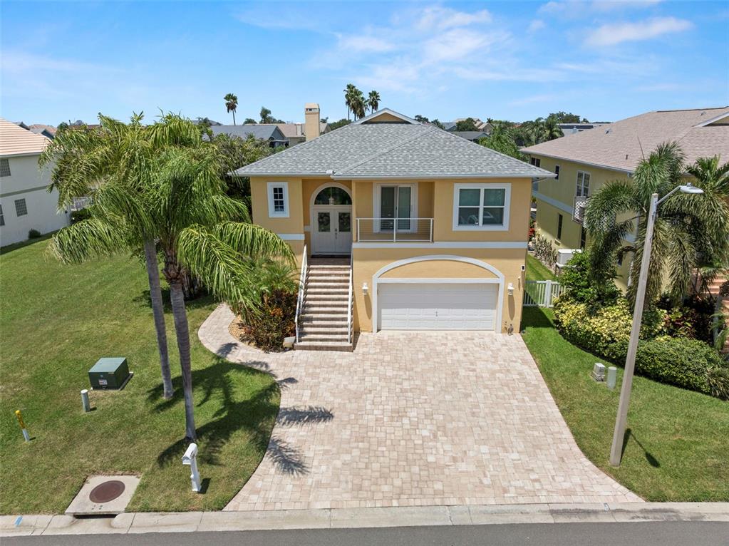 6170 Seaside Drive New Port Richey, FL 34652 - Photo 5 of 89 a front view of a house with garden