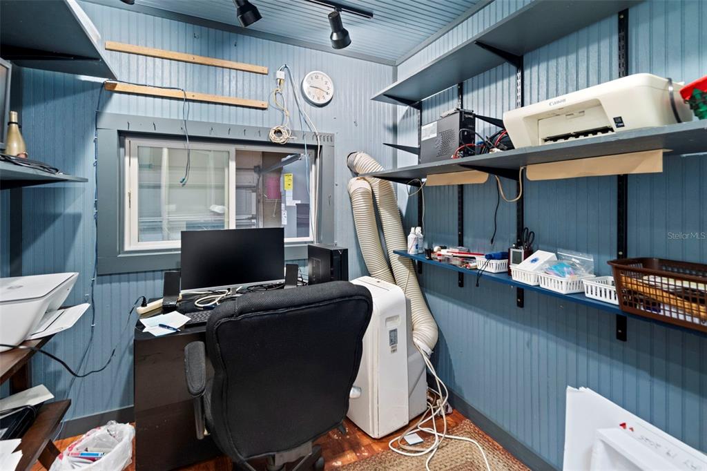 6170 Seaside Drive New Port Richey, FL 34652 - Photo 54 of 89 a work room with furniture and a window
