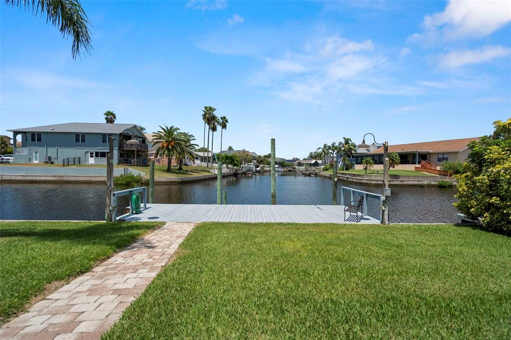 6170 Seaside Drive New Port Richey, FL 34652 - Photo 59 of 89 a view of a house with a yard and sitting area