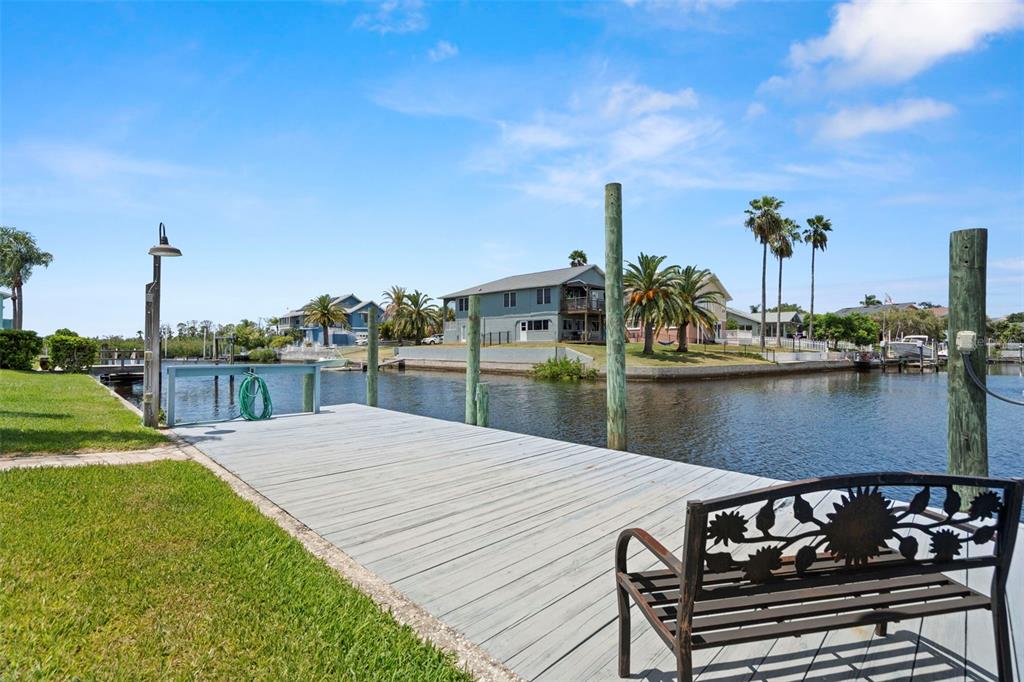 6170 Seaside Drive New Port Richey, FL 34652 - Photo 61 of 89 a view of a lake with chairs