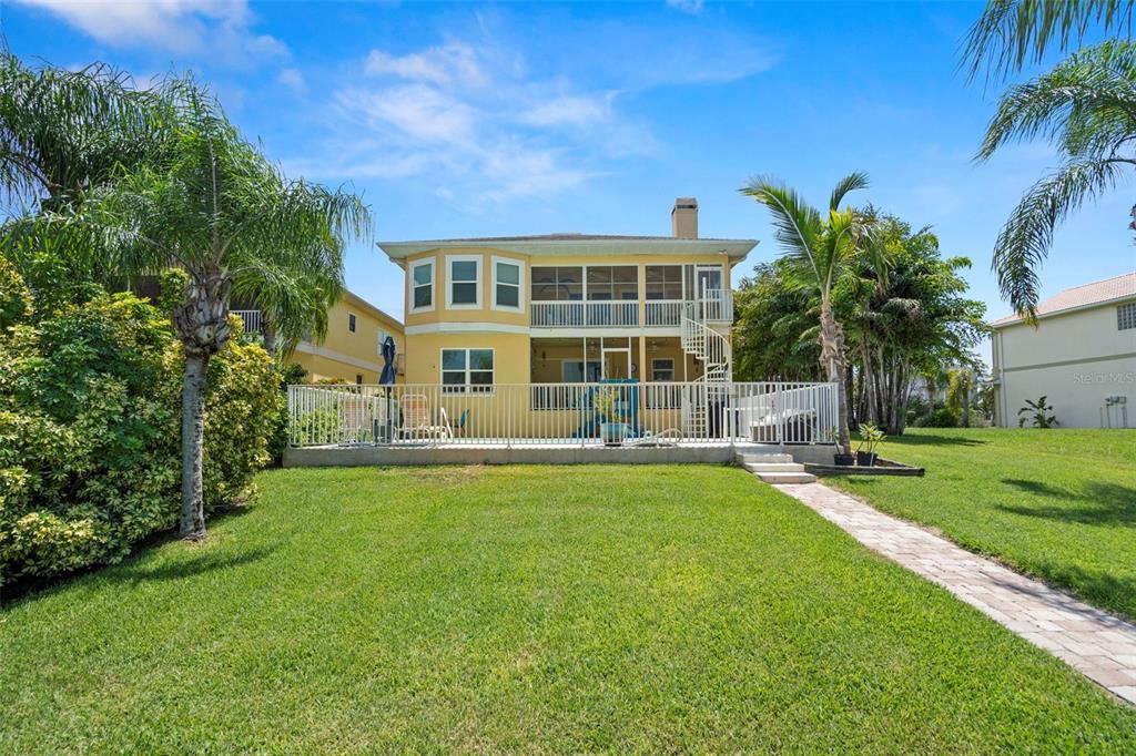6170 Seaside Drive New Port Richey, FL 34652 - Photo 63 of 89 a front view of a house with a yard