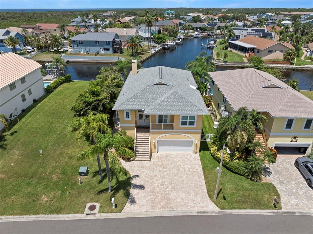 6170 Seaside Drive New Port Richey, FL 34652 - Photo 64 of 89 an aerial view of a house with a yard