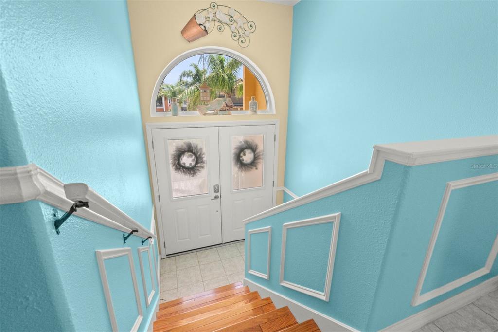 6170 Seaside Drive New Port Richey, FL 34652 - Photo 7 of 89 a view of front door with stairs