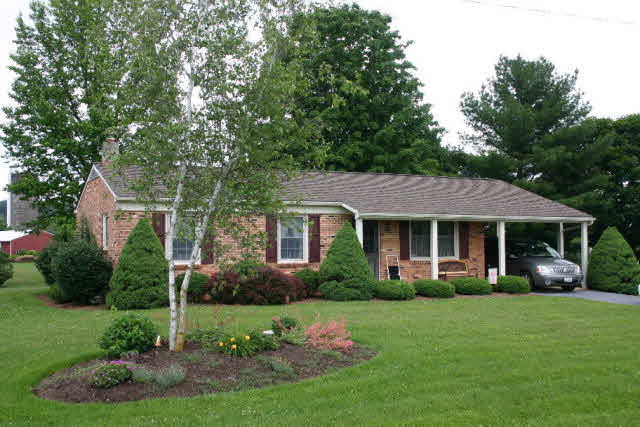 7368 Spring Creek Road Bridgewater, VA 22812 - Photo 1 of 1 front view of a house with a yard