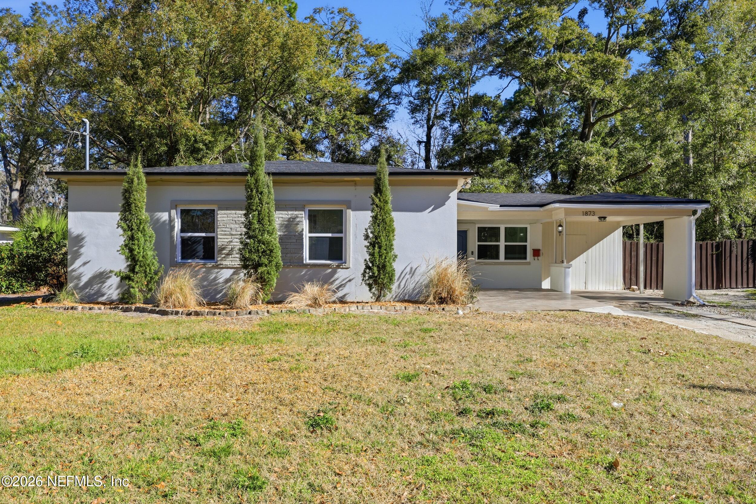 front view of a house with a yard