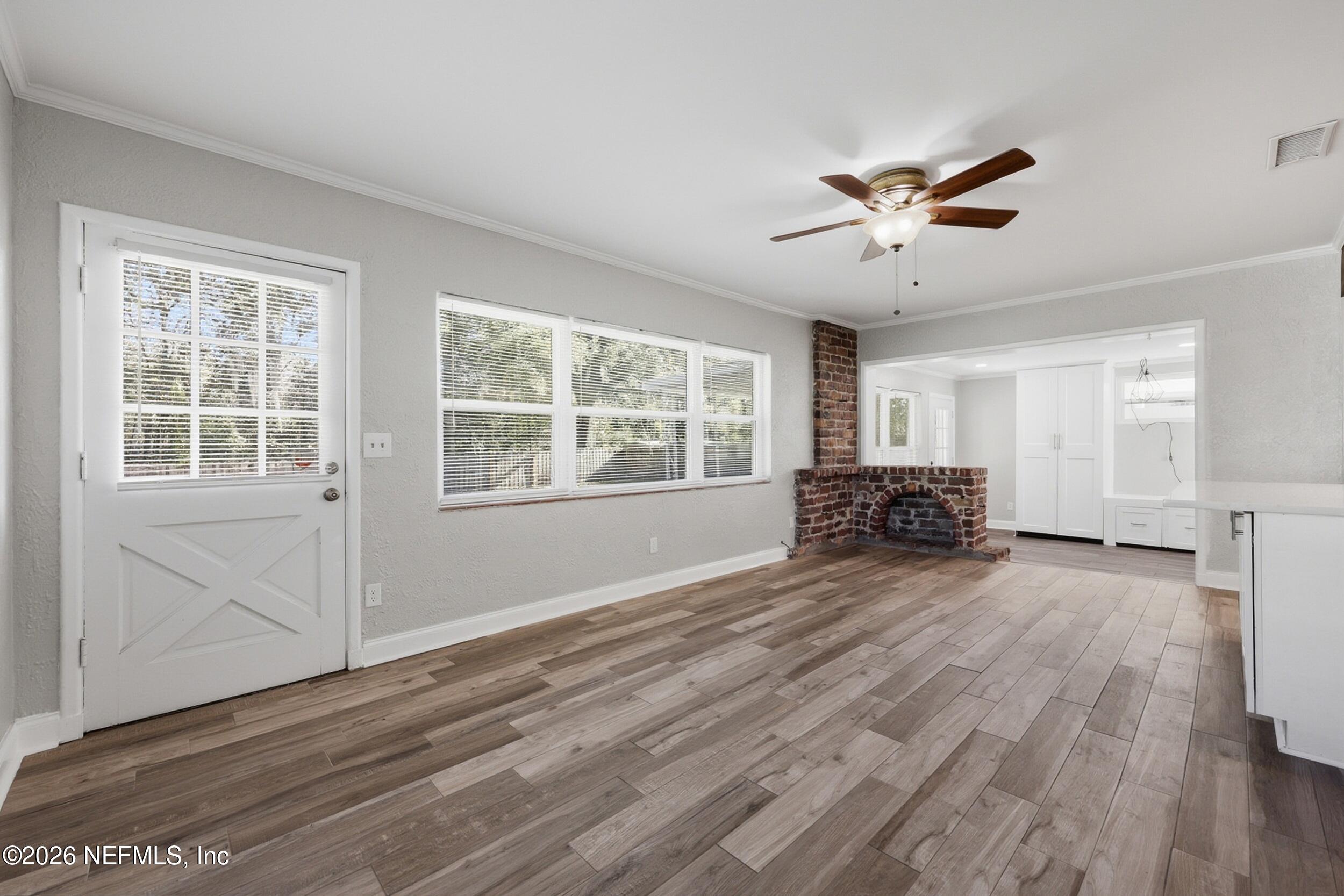 1873 Stanford Road North Jacksonville, FL 32207 - Photo 11 of 37 a view of empty room with wooden floor and fan